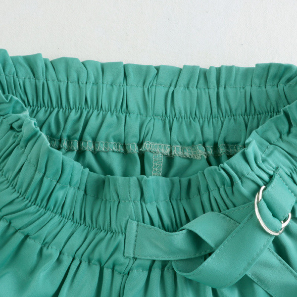 Széles női nadrág gumival és övvel