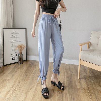 Női nadrág elasztikus derékkal és megkötővel