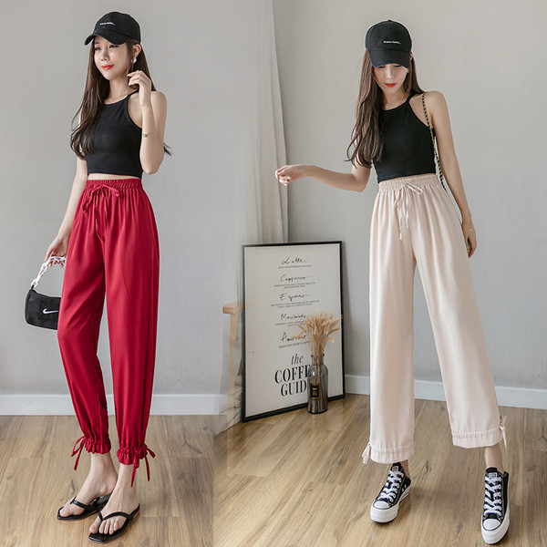 Női nadrág elasztikus derékkal és megkötővel