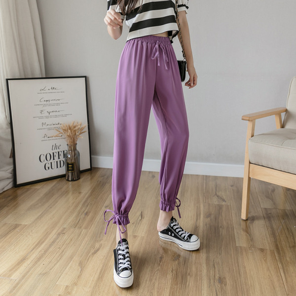 Női nadrág elasztikus derékkal és megkötővel