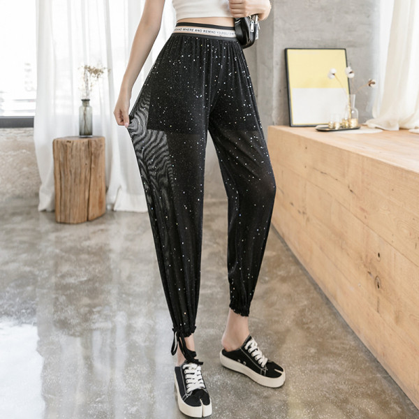 Női nadrág magas derékkal és fényes részecskékkel