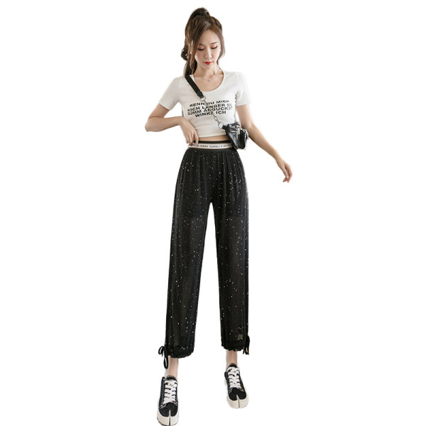 Női nadrág magas derékkal és fényes részecskékkel