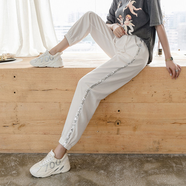 Divatos női nadrág fényes szegéllyel, magas derékkal