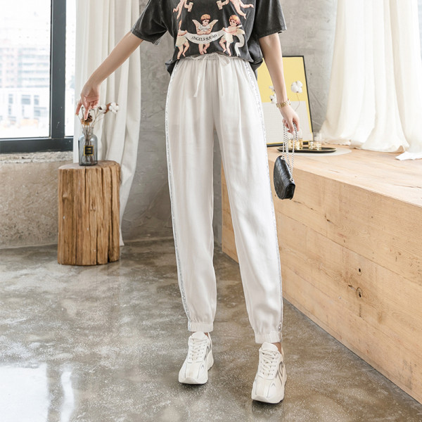 Divatos női nadrág fényes szegéllyel, magas derékkal