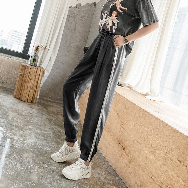 Divatos női nadrág fényes szegéllyel, magas derékkal