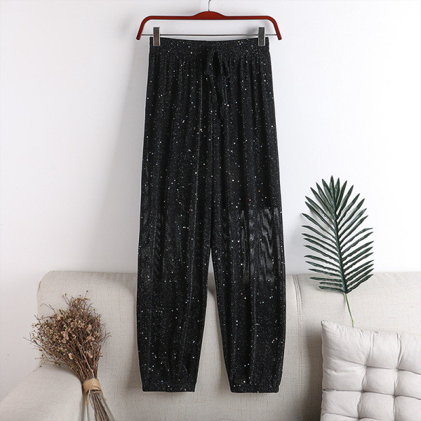 Sieviešu bikses ar spīdīgām daļiņām un saitēm