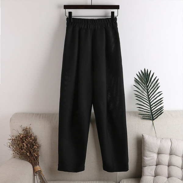 Alkalmi női nadrág gumival és zsebekkel