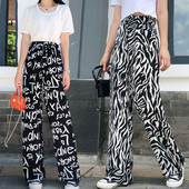 Női nadrág magas elasztikus derékkal és megkötővel