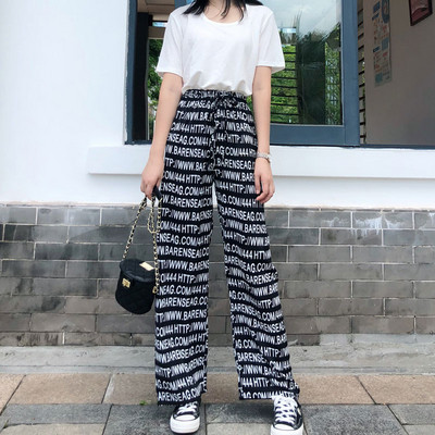 Női nadrág magas elasztikus derékkal és megkötővel