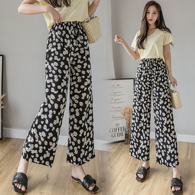 Naiste lillelised püksid kõrge vöökoha ja lipsudega