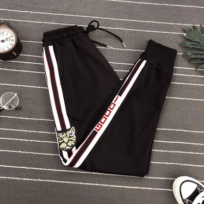 Ikdienas sieviešu bikses ar saitēm, izšuvumiem un fliteriem