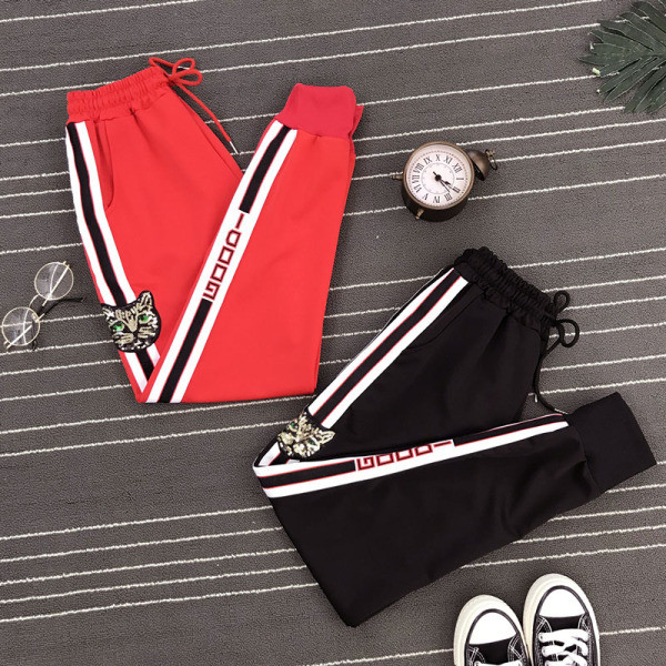 Ikdienas sieviešu bikses ar saitēm, izšuvumiem un fliteriem