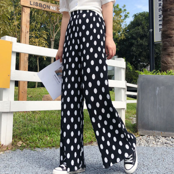 Valge ja musta värvi kõrge vöökohaga vabaaja naistepüksid