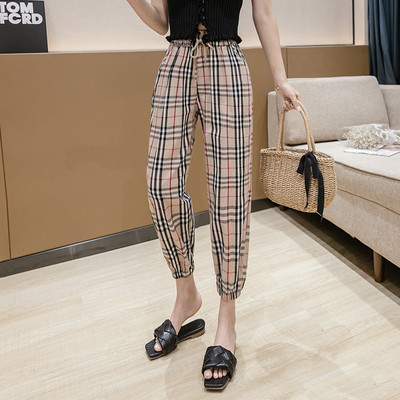 Modern női kockás nadrág magas derékkal és megkötővel