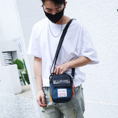 Meeste päevakott ja pealdised ning pikk sangaga