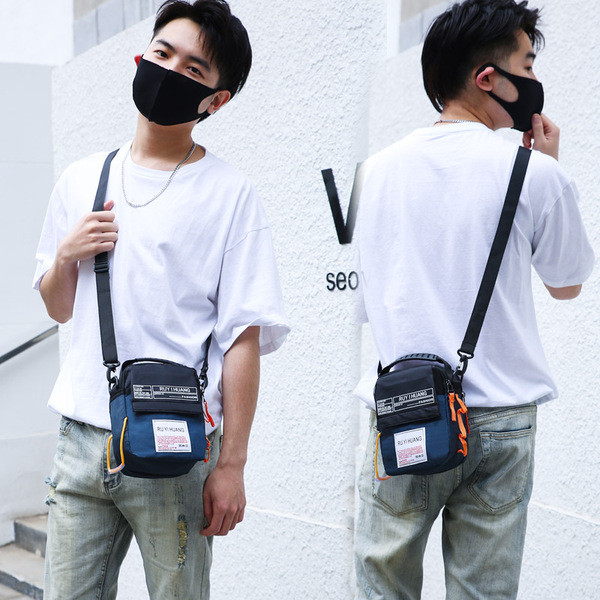 Meeste päevakott ja pealdised ning pikk sangaga