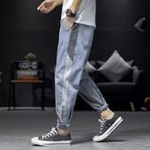 Mūsdienīgi vīriešu garie džinsi ar apmalēm un kabatām