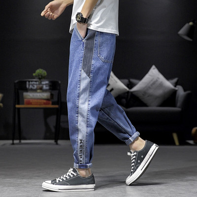 Mūsdienīgi vīriešu garie džinsi ar apmalēm un kabatām