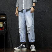 Lezser férfi hosszú farmer széles modell szakadt motívumokkal és cipzárral