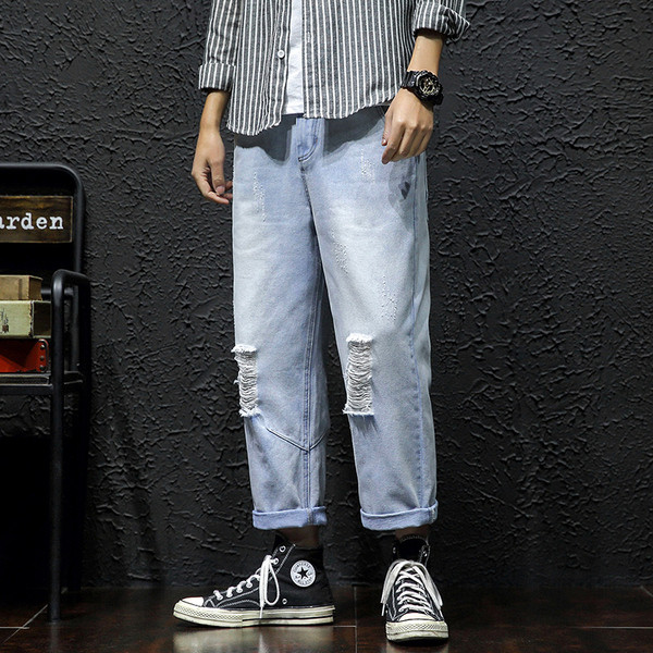 Lezser férfi hosszú farmer széles modell szakadt motívumokkal és cipzárral