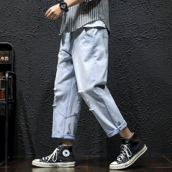 Lezser férfi hosszú farmer széles modell szakadt motívumokkal és cipzárral