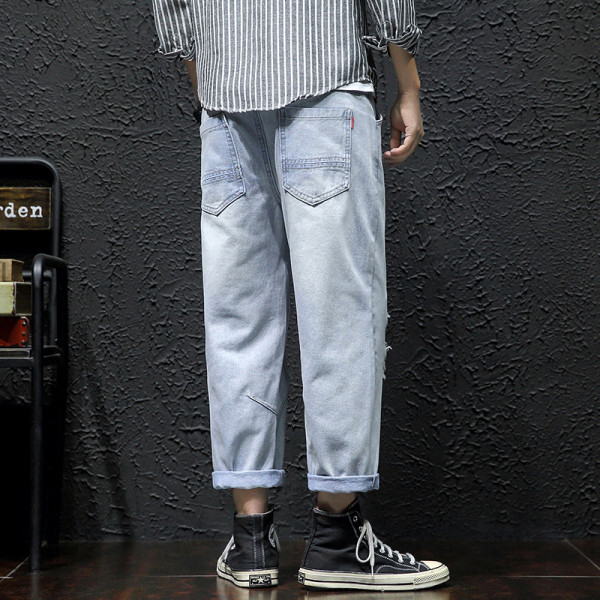 Lezser férfi hosszú farmer széles modell szakadt motívumokkal és cipzárral