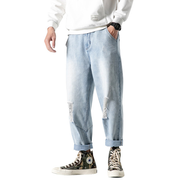 Lezser férfi hosszú farmer széles modell szakadt motívumokkal és cipzárral