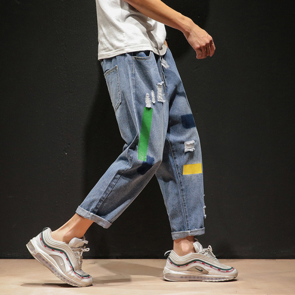 NOVI model muških dugih traperica široki model sa poderanim motivima