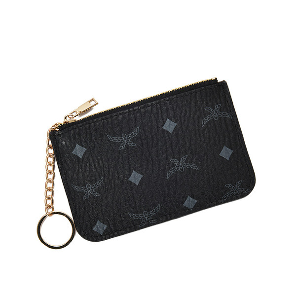 Eko bőrből készült vékony női pénztárca fém lánccal és applikációkkal