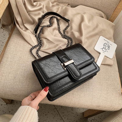 Női bőrtáska hosszú vas fogantyúval