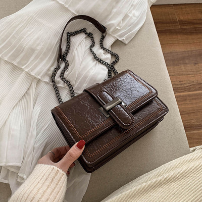 Női bőrtáska hosszú vas fogantyúval