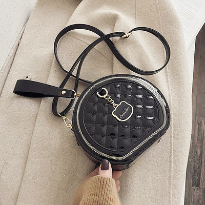 Stílusos női táska kerek formában - eko bőrből