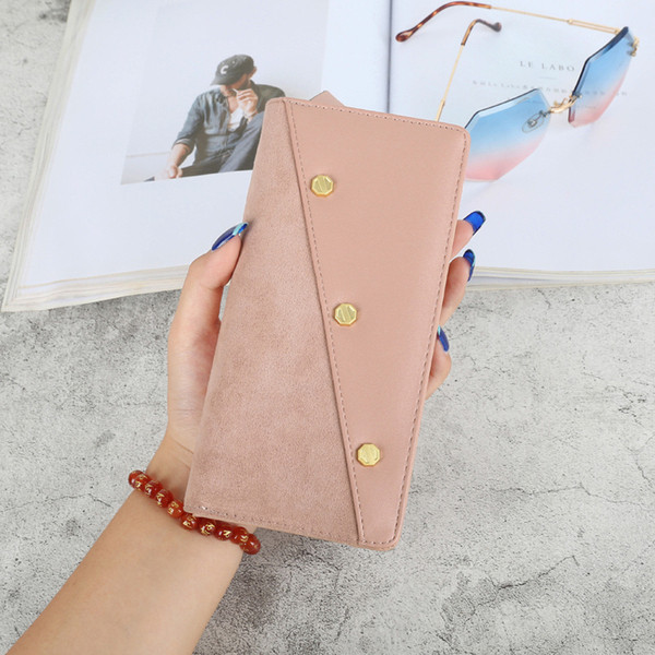 Μοντέρνο γυναικείο πορτοφόλι με φερμουάρ και μεταλλικά στοιχεία