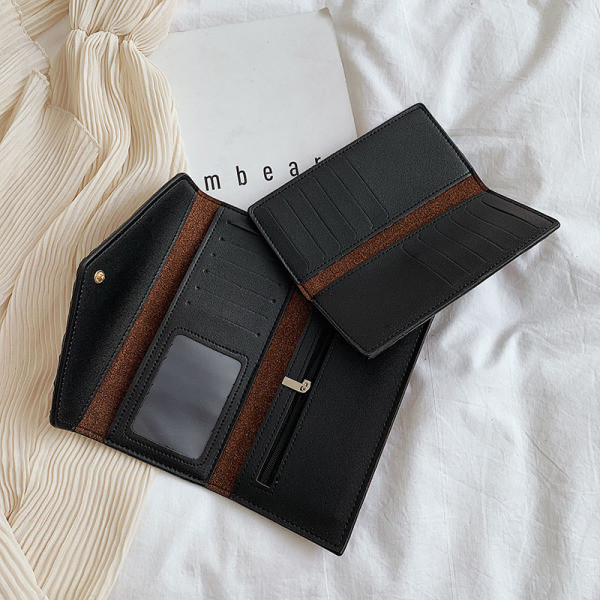 Naiste ökonahast rahakott reljeefse katte ja puukujulise kaunistusega