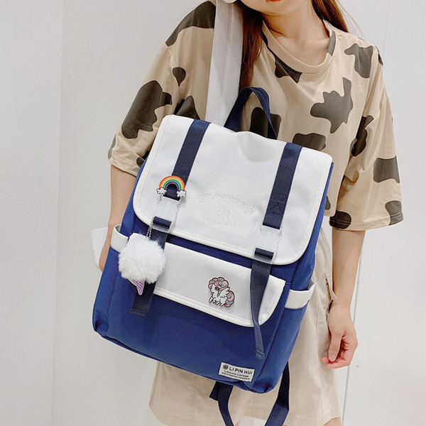 Moodne naiste seljakott värviliste laiade rihmadega