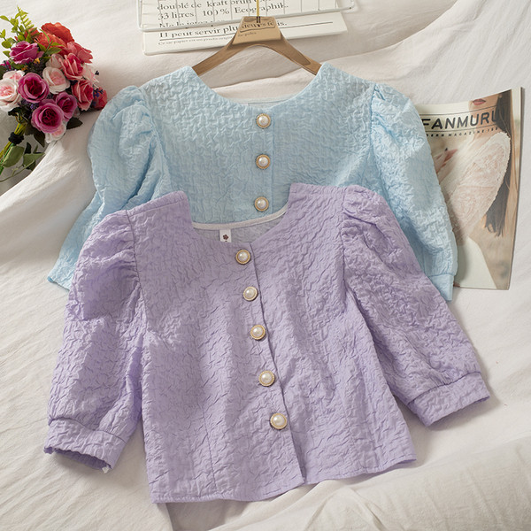 Lühike ümara kaeluse ja nööpidega naiste särk