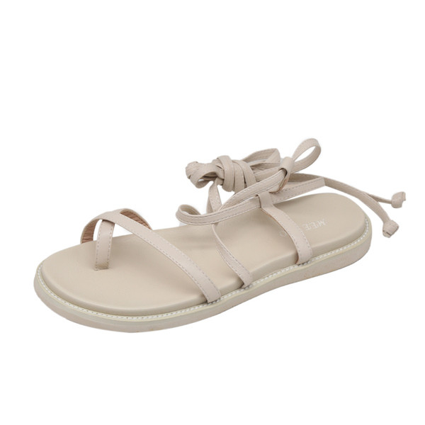 Modern női szandál lapos talppal és fűzővel