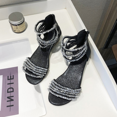 Σύγχρονα γυναικεία σανδάλια με επίπεδη σόλα, λεπτούς ιμάντες και διακοσμιτικές πέτρες