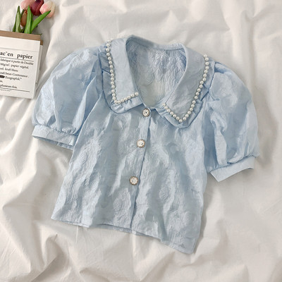 Moderns sieviešu krekls ar mežģīnēm un pērlēm