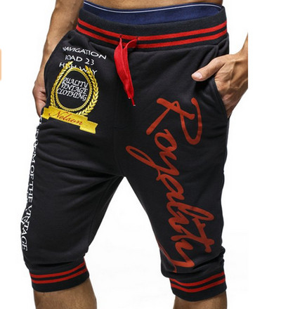 Meeste vabaaja püksid pikkusega 7/8 kirjadega