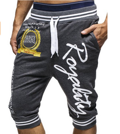 Meeste vabaaja püksid pikkusega 7/8 kirjadega