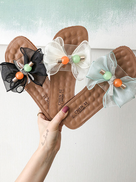 Női papucs lapos talppal és pecsétszalaggal