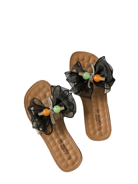 Női papucs lapos talppal és pecsétszalaggal