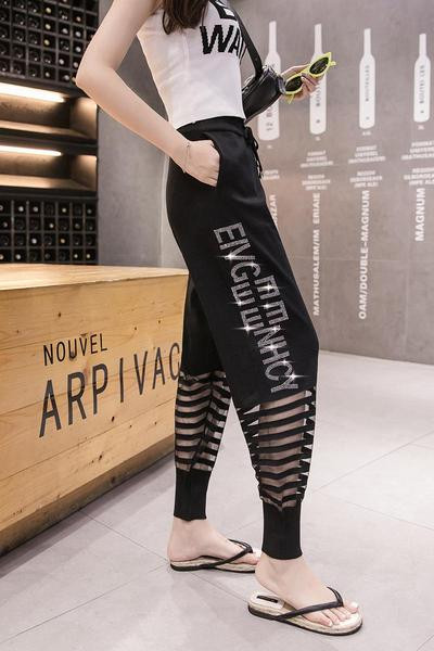 Moderne ženske hlače s mrežicom i kamenčićima