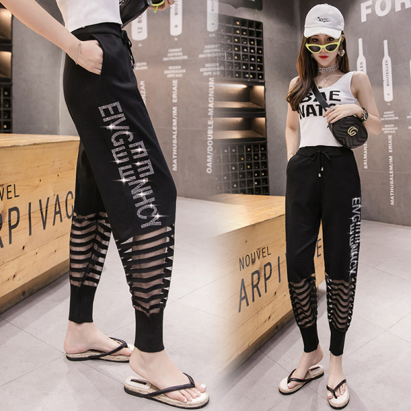 Moderne ženske hlače s mrežicom i kamenčićima