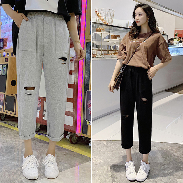 Ležerne ženske široke hlače s poderanim motivima