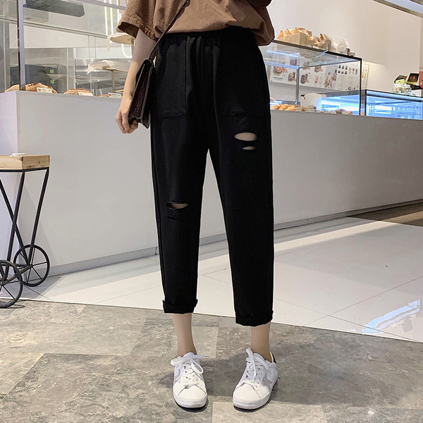 Ležerne ženske široke hlače s poderanim motivima