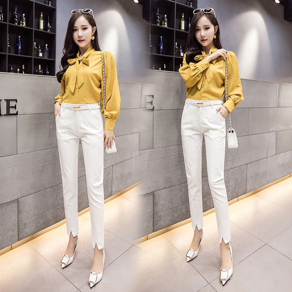 Modern női nadrág magas derékkal és hasítékkal