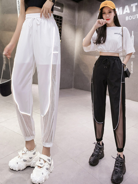 Modern női átlátszó nadrág fényvisszaverő csíkokkal