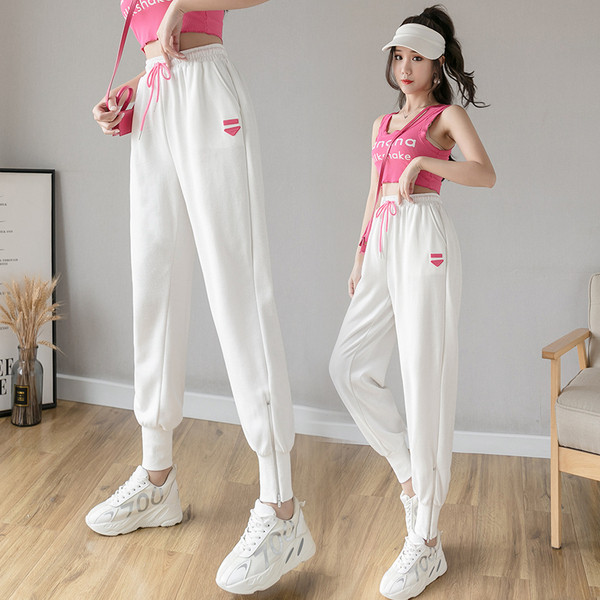 Alkalmi női nadrág rátéttel és nyakkendővel